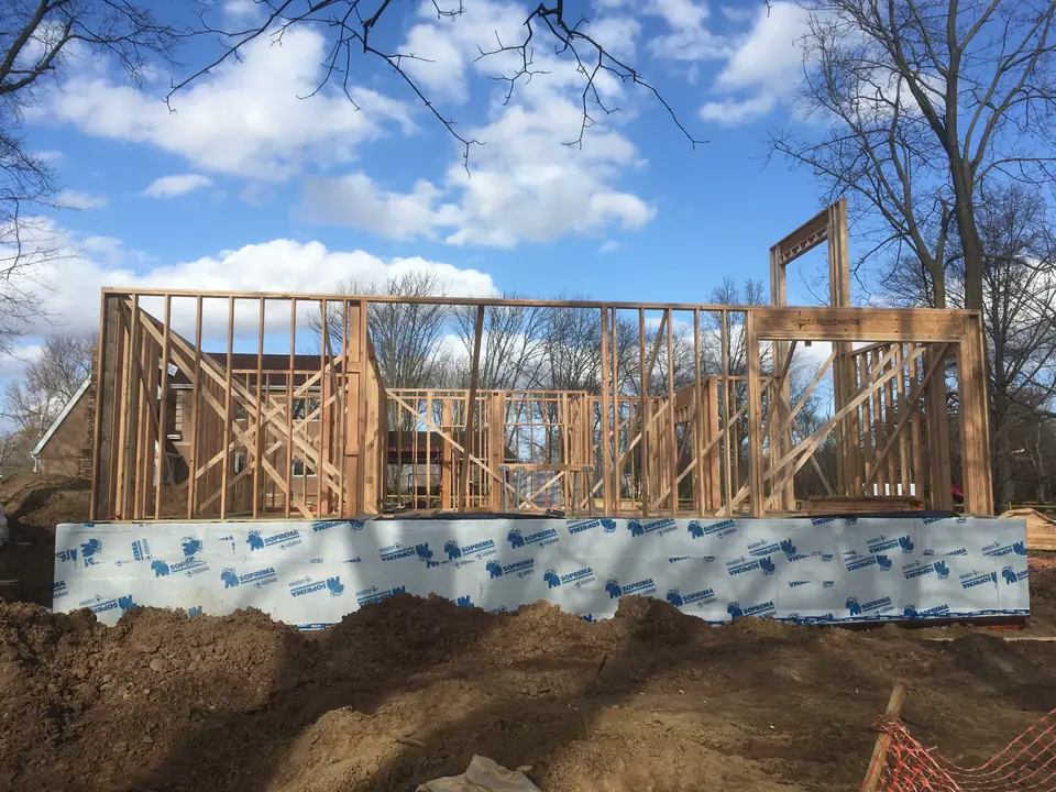 All load-bearing walls are conventional 2×6 construction reinforced at the corners and cantilever overhangs for stability during windy 