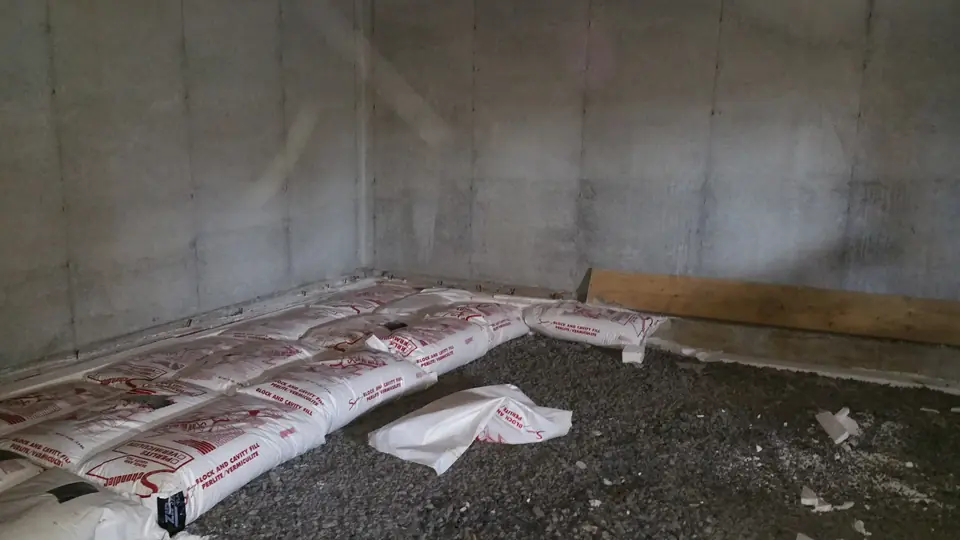 In order to create a continuous thermal break, the basement floor has to be insulated as well. We used roughly 150 bags of construction grad