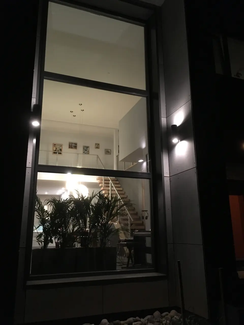 Our glass wall view from the outside at night.