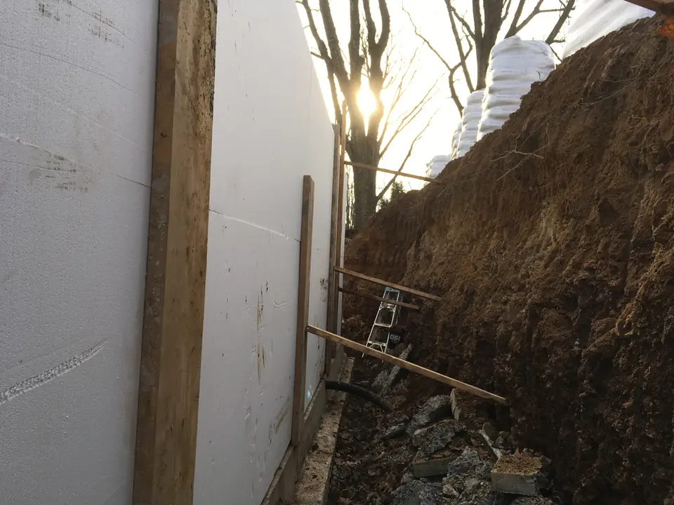 When the basement walls are poured in, it’s time to insulate the wall exterior with the foam blocks. These are 25 psi, 5” thick sheets that 