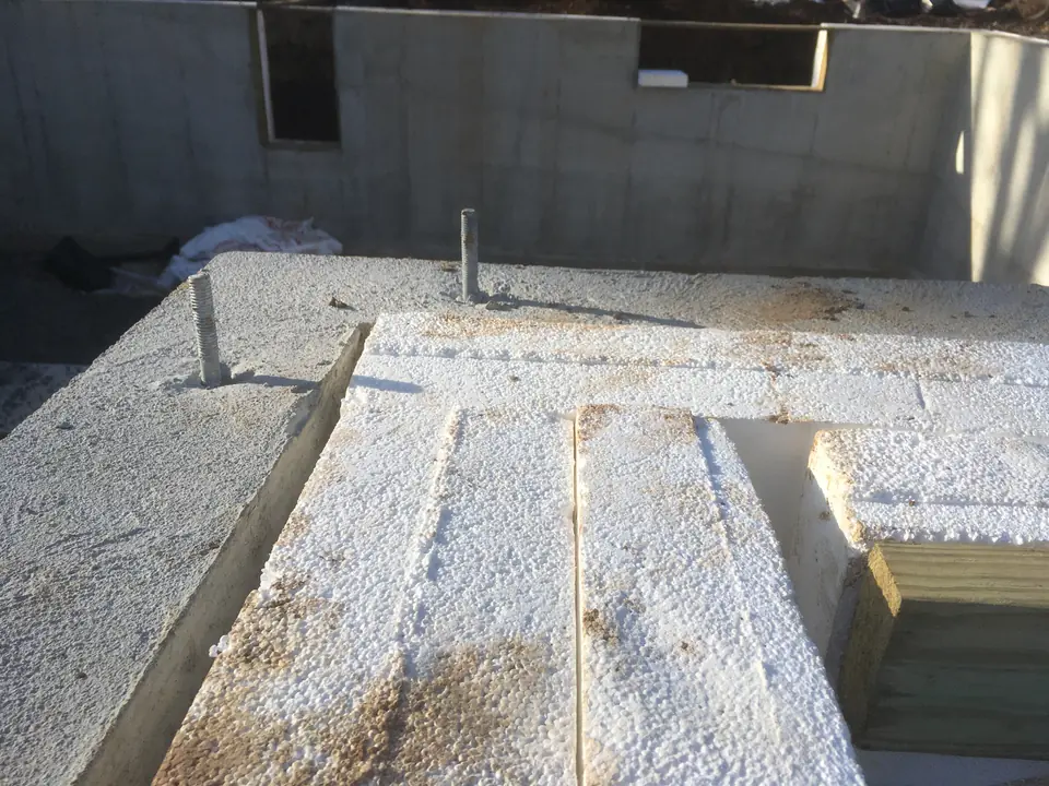 We ran two staggered layers of foam blocks around the entire wall surface. The total thickness of wall insulation is 10” with R-value at aro