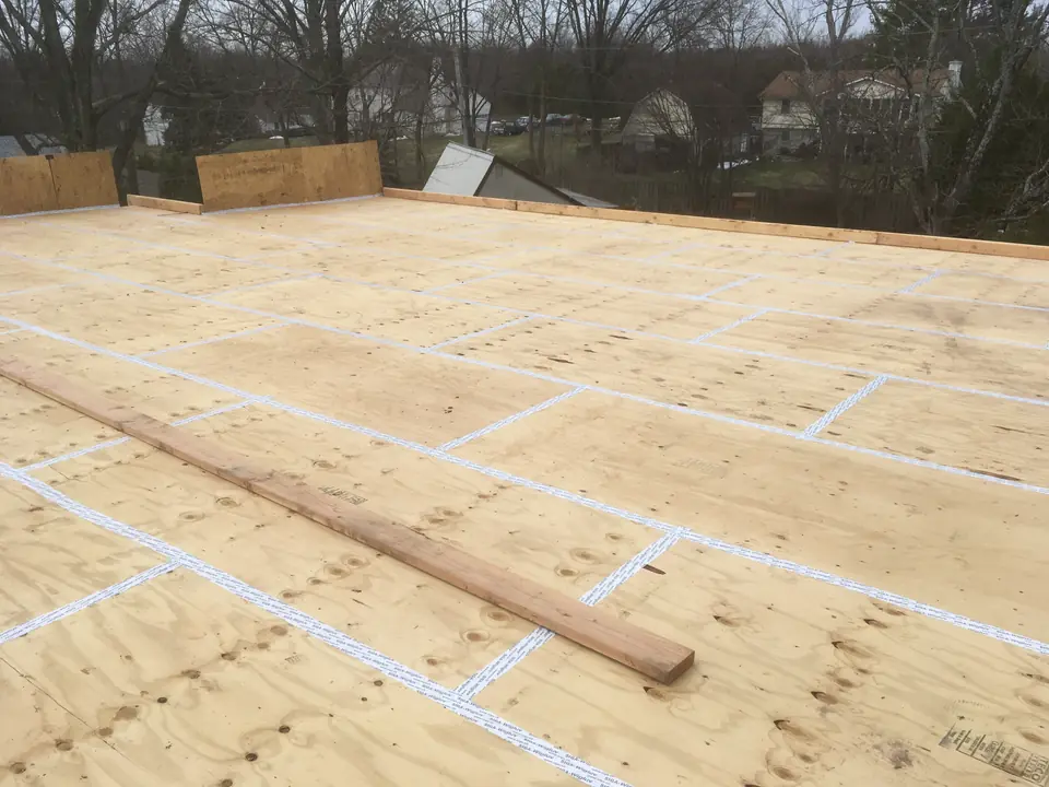 Roof sheathing with parapet walls being built. We left the back wall completely open to allow water to run freely into the gutters.